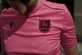 Pink sports jersey with a logo on the chest